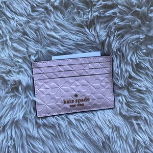 Very light pink, small, slim card holder from Kate Spade